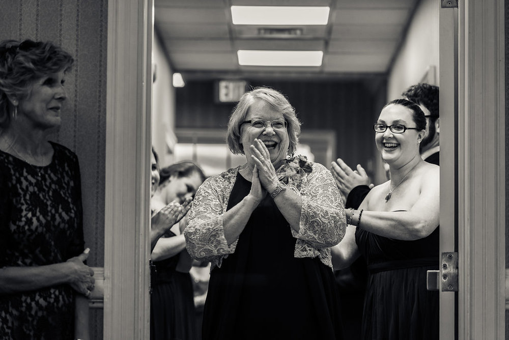 Mom excited to be introduced in Pilot Knob Country Club. Wedding Photography by Party of Two Photography.