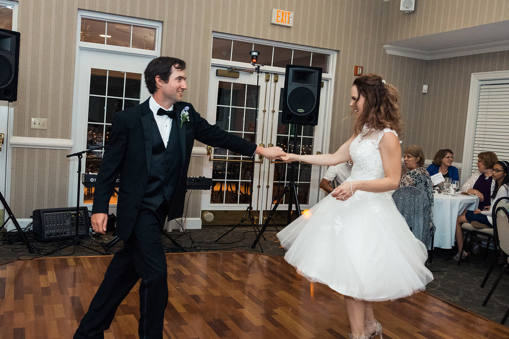 Bride and groom's first dance in Pilot Knob Country Club. Wedding Photography by Party of Two Photography.