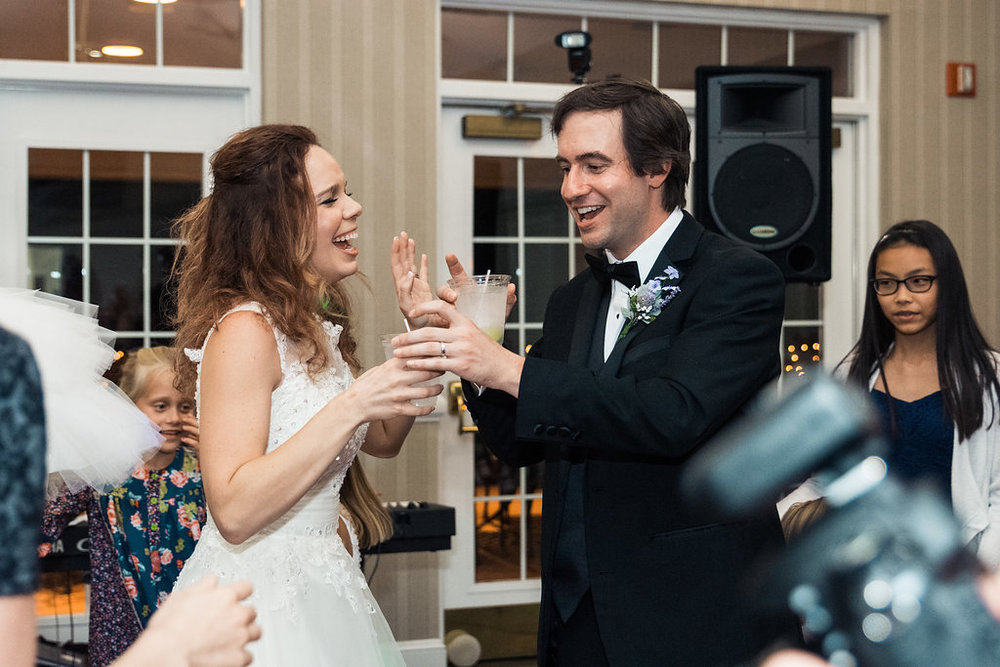 Reception shot of Bride and Groom dancing in Pilot Knob Country Club. Wedding Photography by Party of Two Photography.
