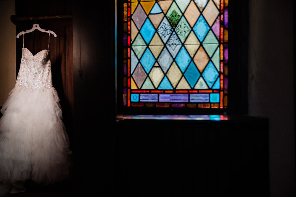 Wedding Dress and Stained Glass at St. Mary's Chapel Wedding in Charlotte NC