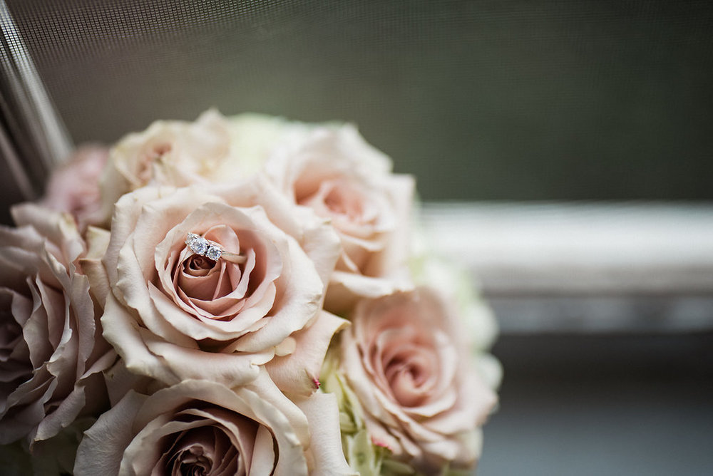 Beautiful Wedding Rings and Flowers at Duke Mansion Reception