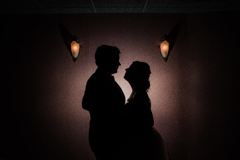 Bride and Groom Silhouette at Levine Museum of the New South Reception from Charlotte Wedding Photographer