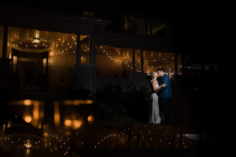 Bride and Groom Night Porch Photo at Ritchie Hill Venue in Concord NC by Charlotte Wedding Photographers