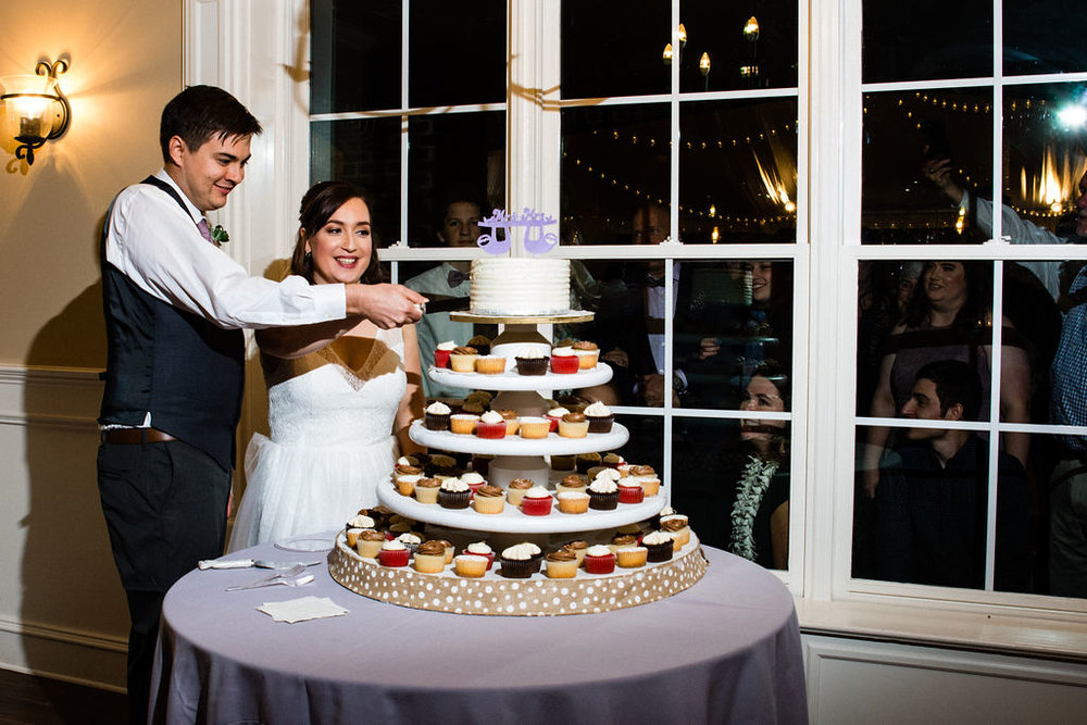 Cake Cutting at Reception at Bride at The Oaks at Salem Wedding in Apex, NC by Charlotte Wedding Photographers