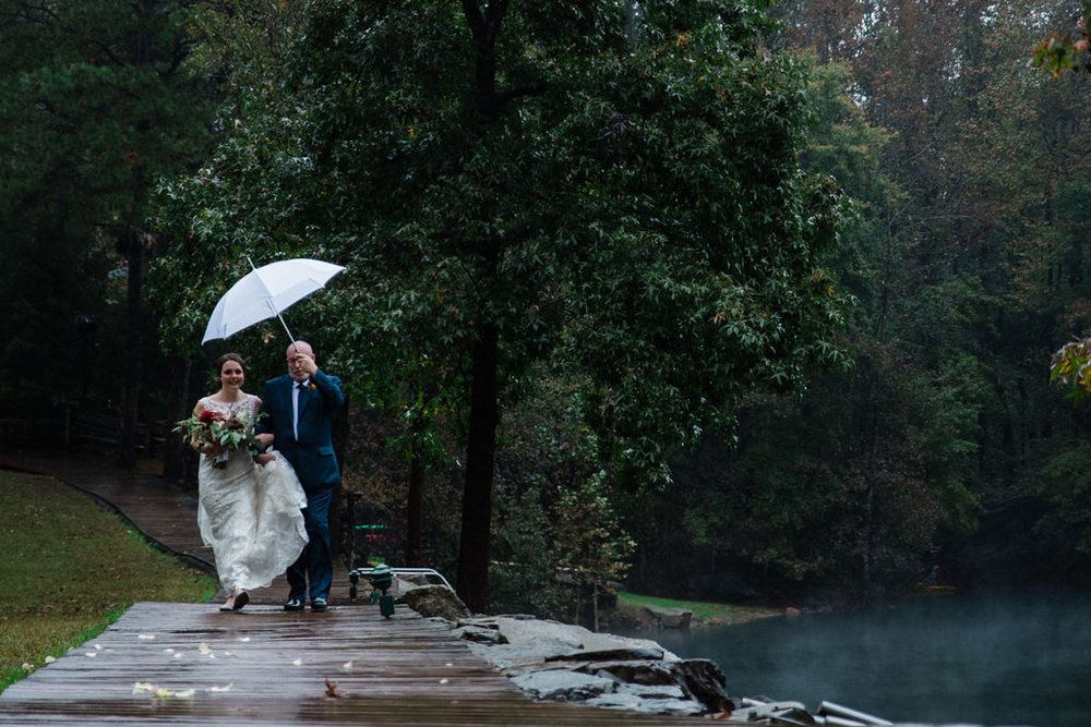 Bride Walking Down Aisle in Ceremony at Quarry at Carrigan Farms by Charlotte Wedding Photographers
