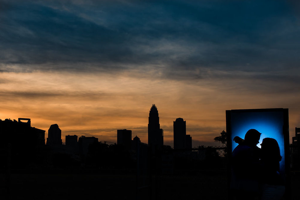 Uptown skyline silhouette at Independence Park Engagement Session by Charlotte Wedding Photographers