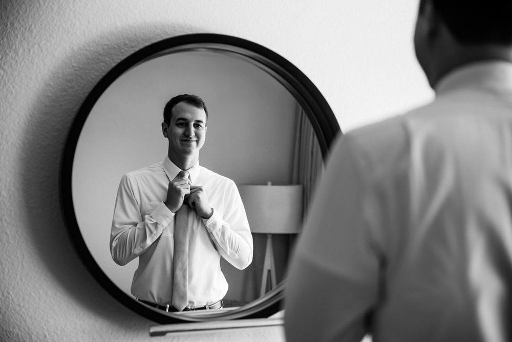 Groom Getting Ready at Hotel Ballast in Wilmington NC by Charlotte Wedding Photographers