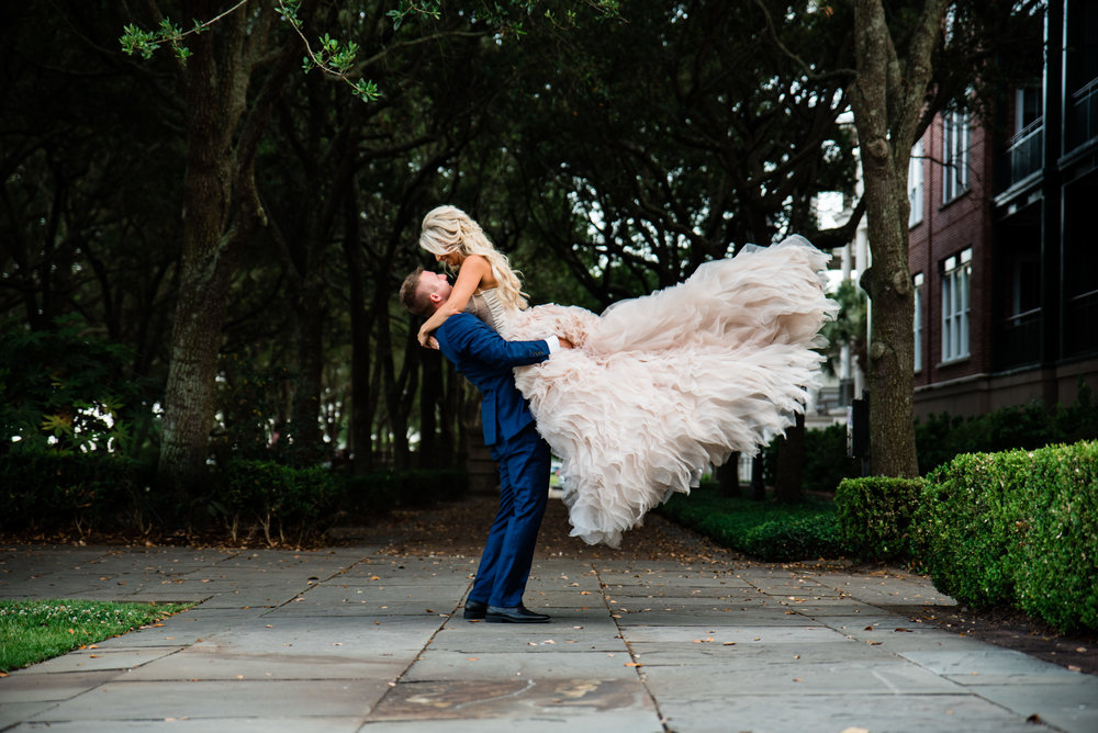 Bride and Groom Portraits at the Waterfront Park in Charleston by Charlotte Wedding Photographers