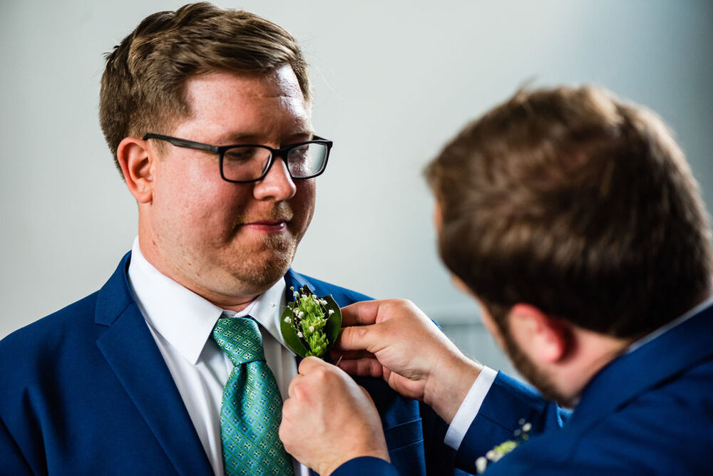 Groom and boutonnieres at Pleasant Grove United Methodist Church Raleigh wedding by Charlotte Wedding Photographers