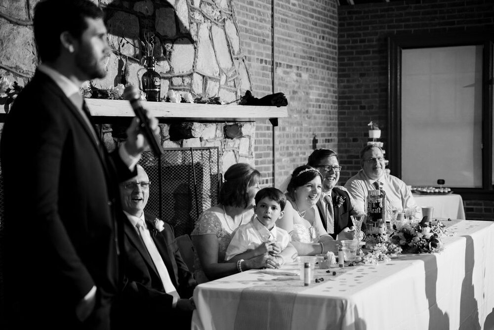 Toasts at reception at Campbell Lodge Reception, Durant Nature Preserve, Raleigh wedding by Charlotte Wedding Photographers