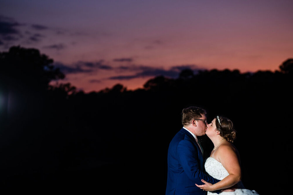 Bride and groom sunset portraits at Campbell Lodge Reception, Durant Nature Preserve, Raleigh wedding by Charlotte Wedding Photographers