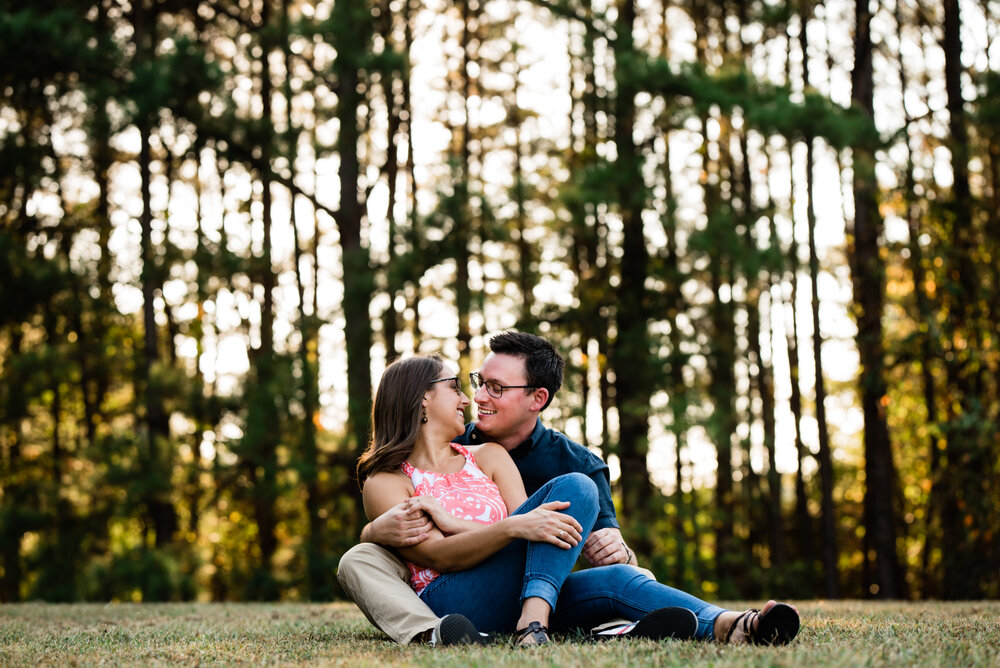 Cute engagement photos with trees in the background at Jetton Park