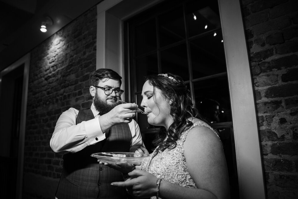Fall Laboratory Mill Wedding reception pie cutting by Charlotte Wedding Photographers