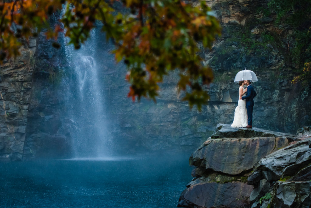 Rainy Day Bride and Groom Umbrella Portrait at Quarry at Carrigan Farms by Charlotte Wedding Photographers