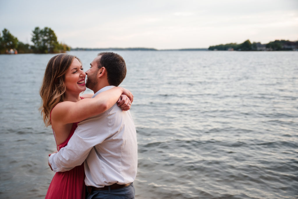 Cute laughing engagement photos at Jetton Park in Charlotte, NC