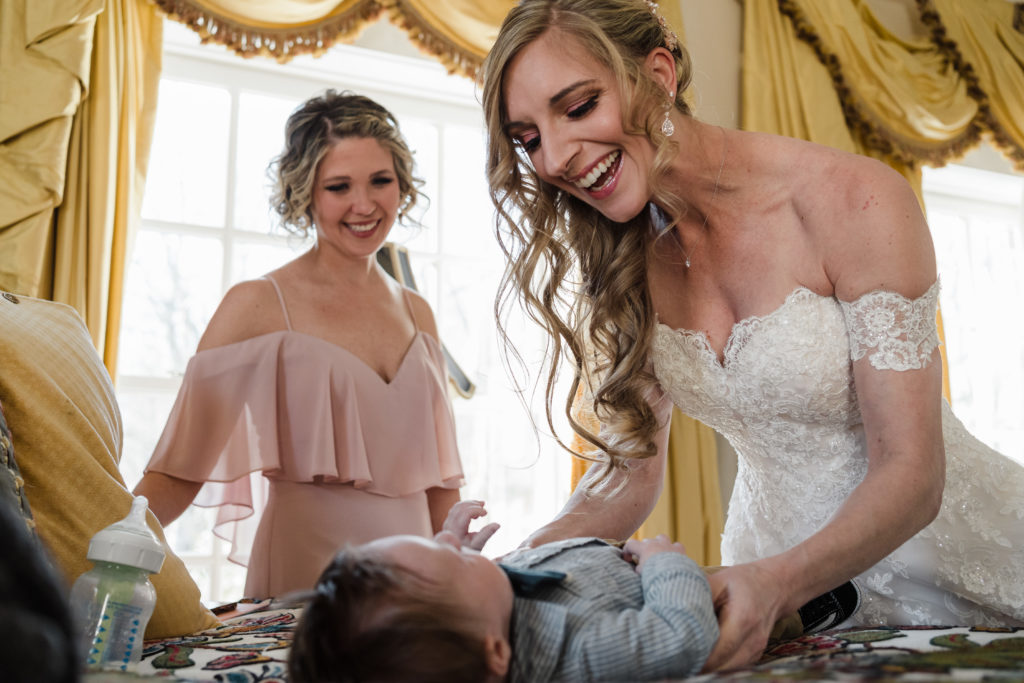 Bride with young child at wedding