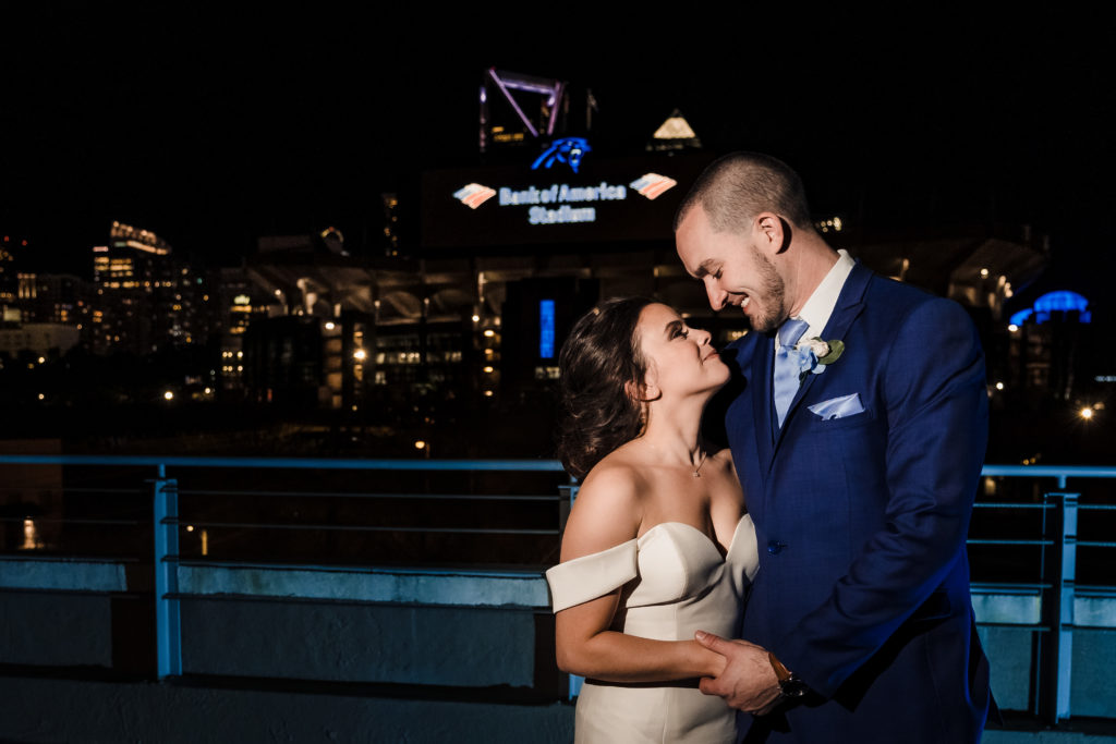 Nighttime Wedding Photos with Uptown Charlotte Skyline