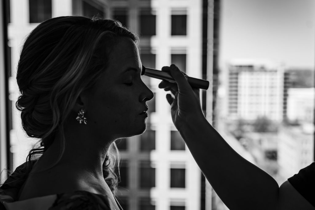 Bride getting makeup on at the Grand Bohemian Hotel in Uptown Charlotte