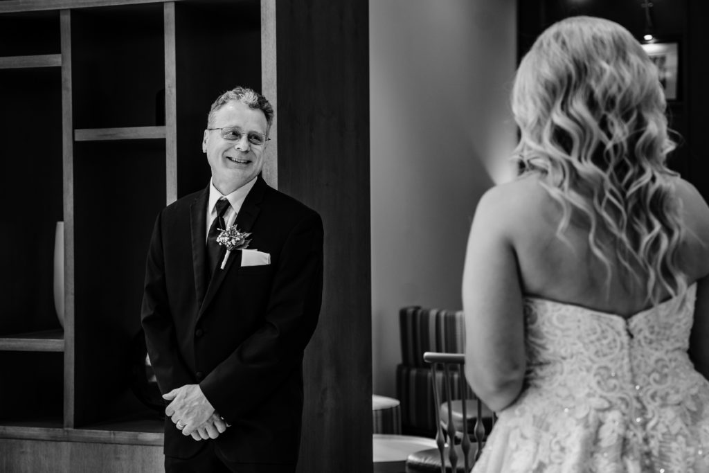 First look with a bride's dad before her wedding at Springhill Suites in Uptown Charlotte