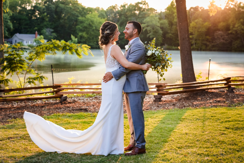 Couples portrait during sunset by the lake at Riverwood Manor Wedding Reception