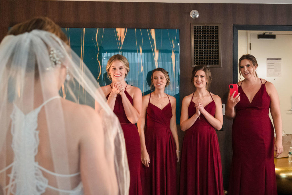 First look with bridesmaids at Omni Hotel Charlotte