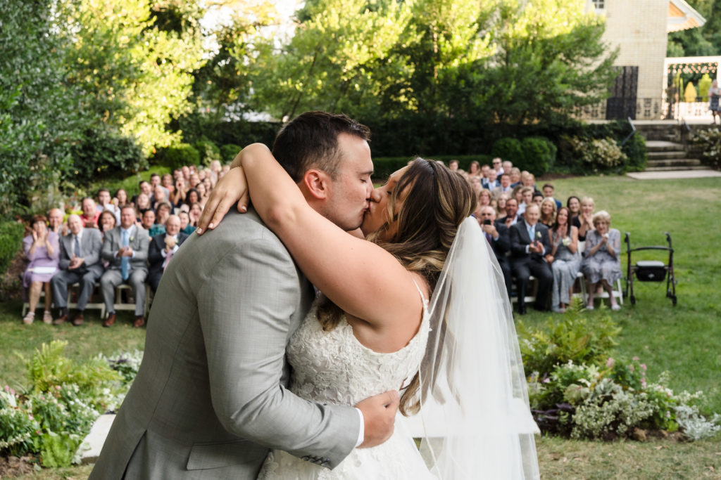 Charlotte wedding photographers capture first kiss between bride and groom