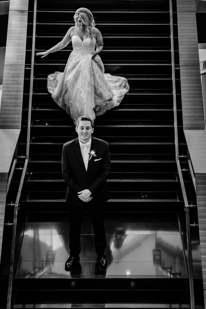 First look on the stairs from a wedding at Springhill Suites in Uptown Charlotte