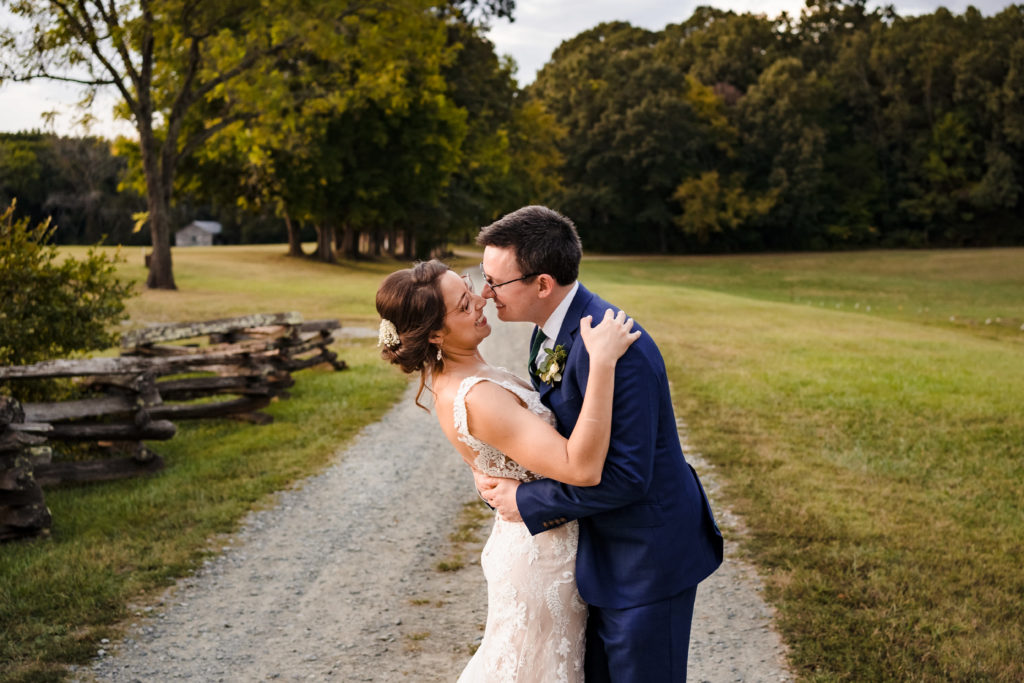 Husband and wife wedding portrait on a gravel road in North Carolina