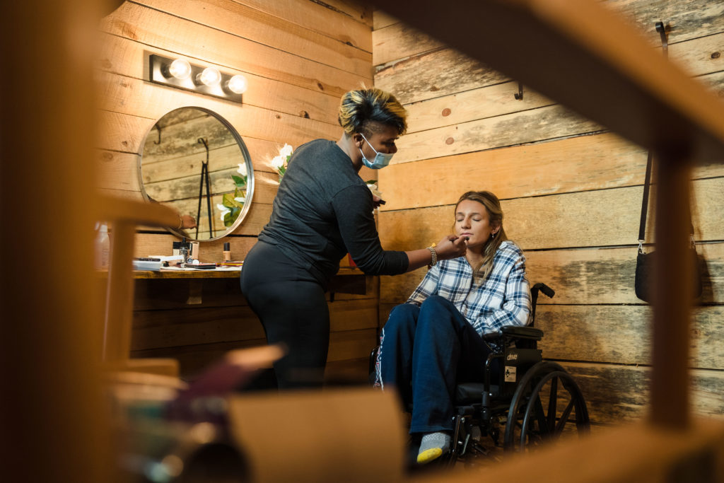 Bride in wheelchair getting her wedding makeup done