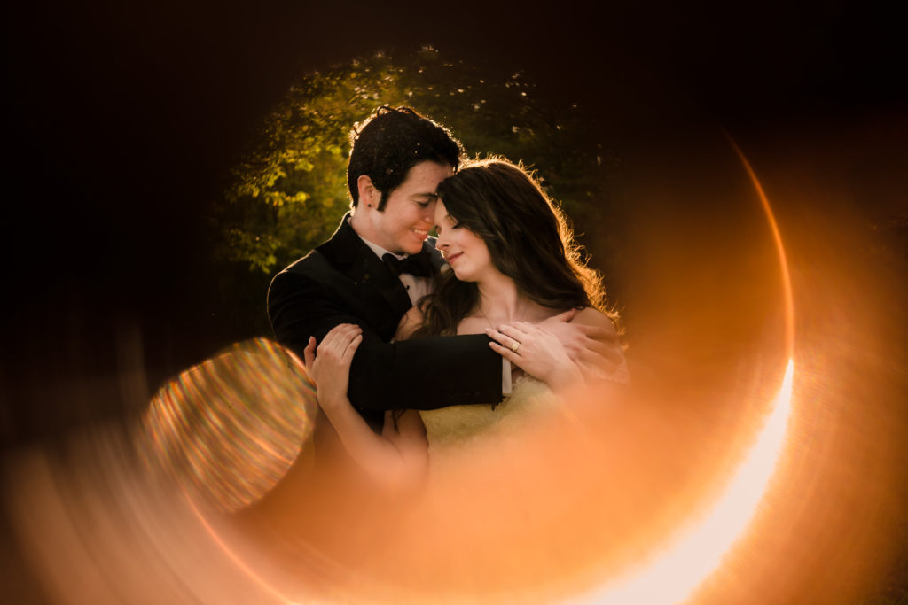 Newly married wedding portrait using ring of fire technique