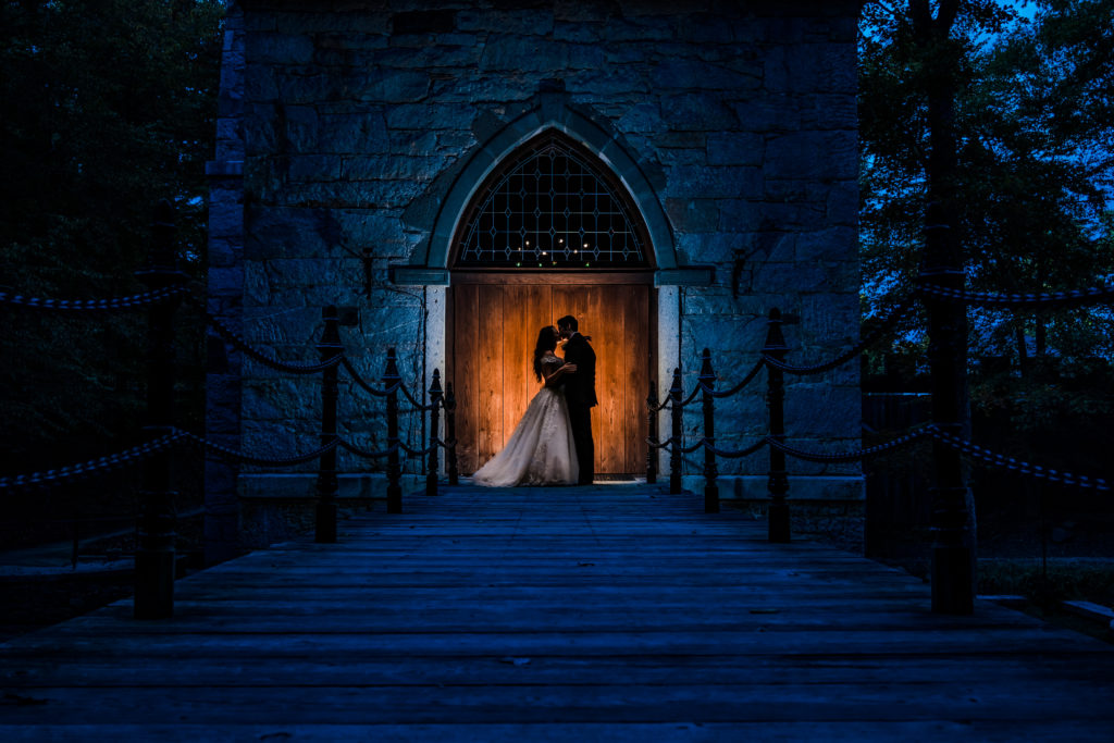 Creative fairy tale wedding portrait with bride and groom at Castle McCulloch