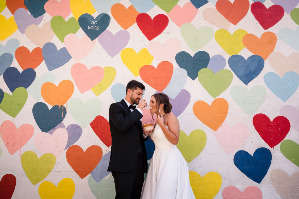 Confetti Heart Wall and newlyweds in South End Charlotte