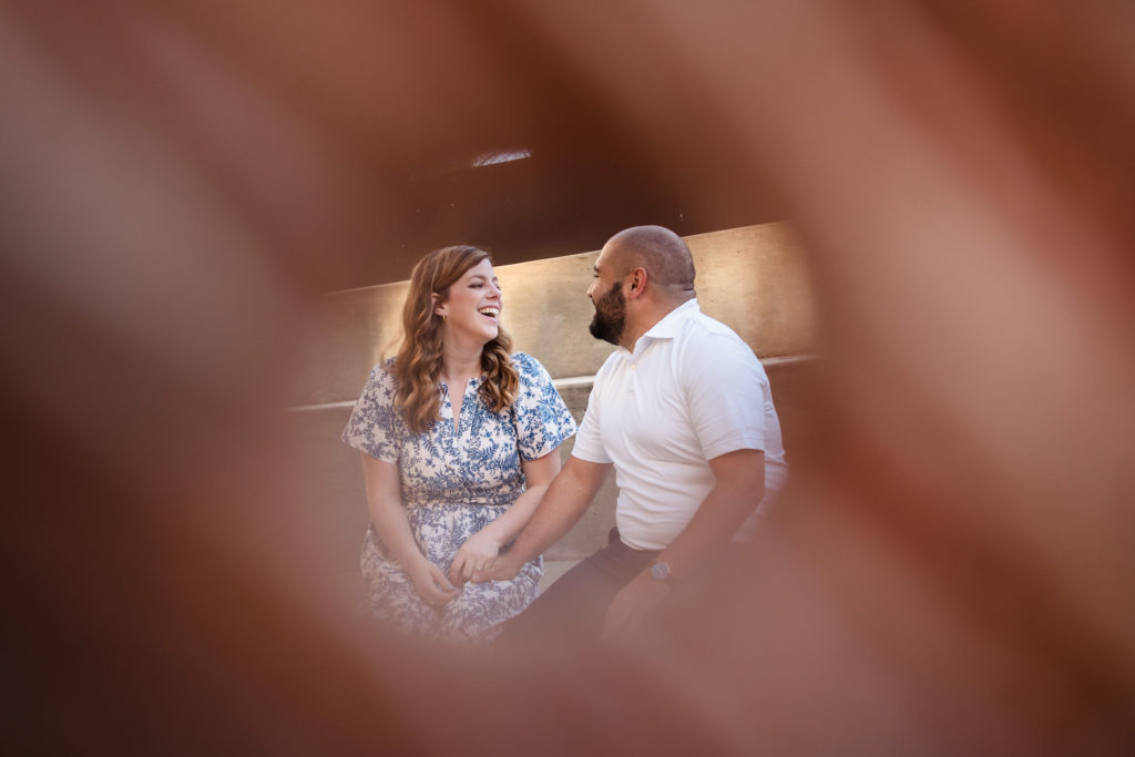 Couple framed by donut during Charlotte engagement session