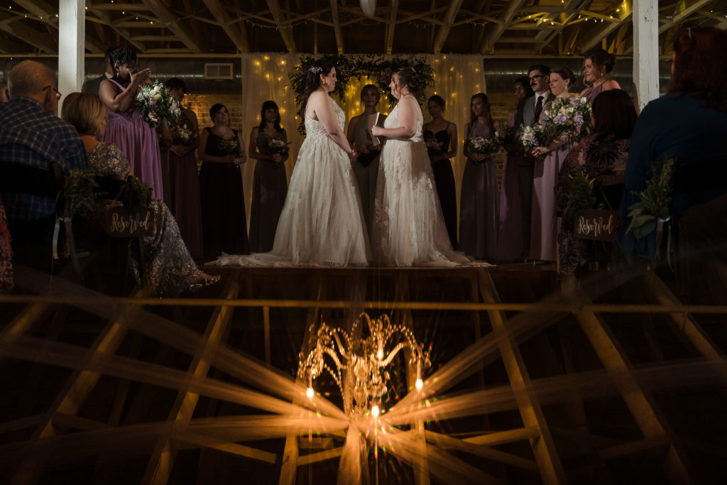 Industrial wedding ceremony with two brides