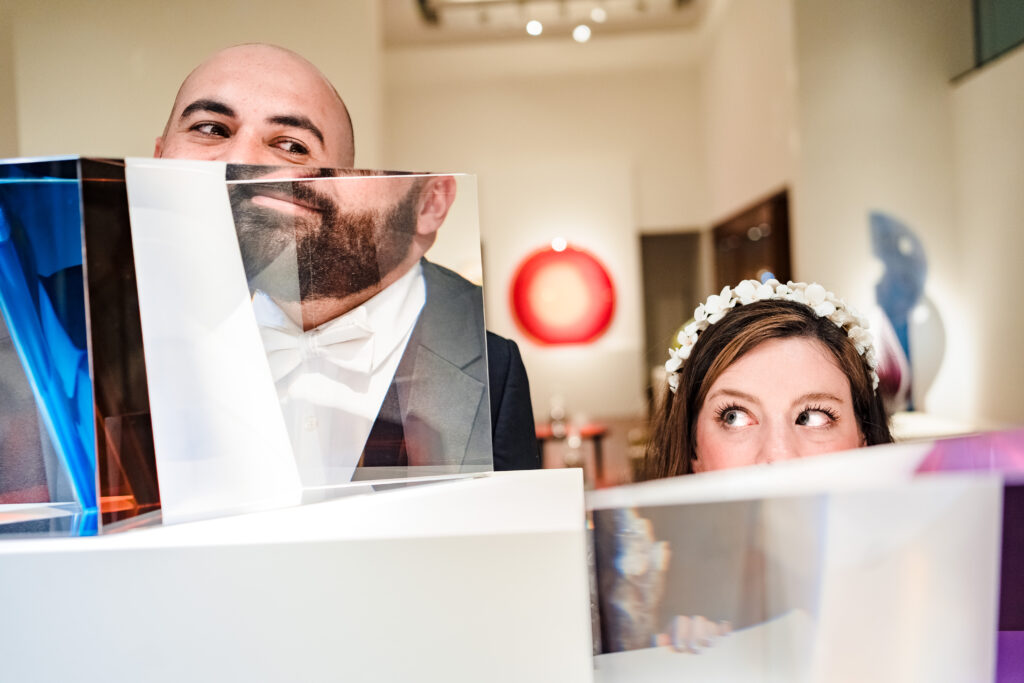 Portrait with art sculptures at 220 North Tryon Wedding