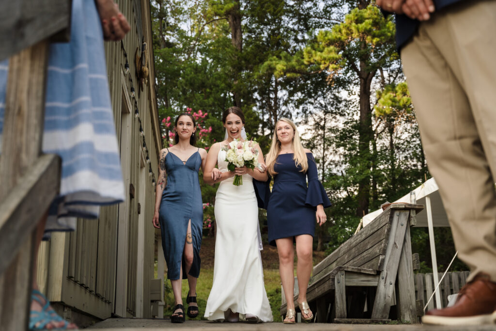 Kate walking down the aisle to her intimate lakeside wedding on Lake Norman