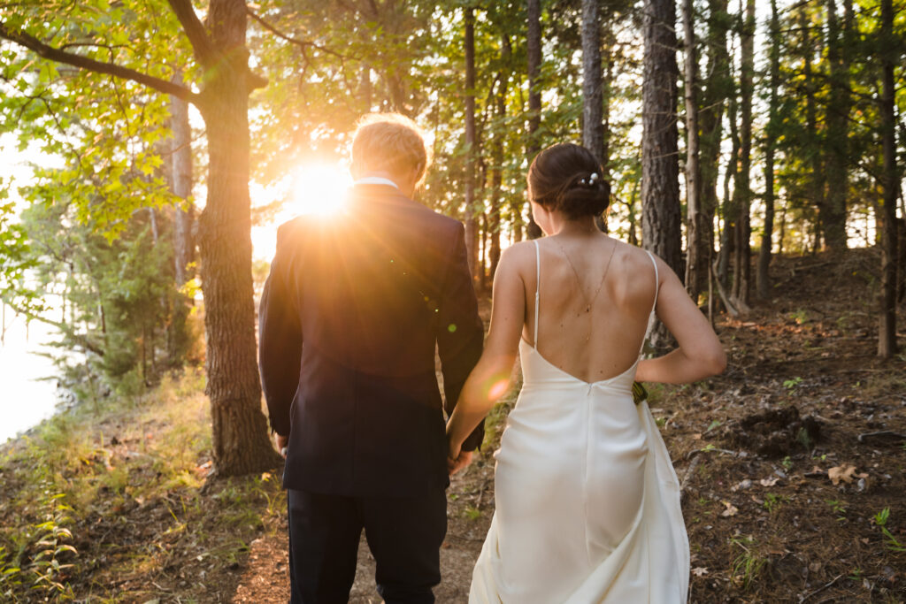 Sun-drenched golden hour wedding photo by Lake Norman near Charlotte, NC