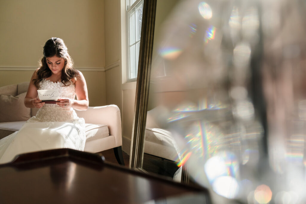 Bride has private moment reading note from groom