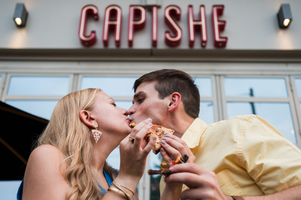 Kiss with pizza at engagement session