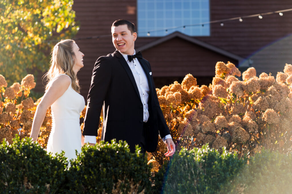 Couple walking to fall wedding at Mountain House Inn