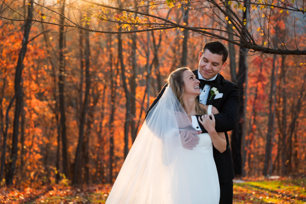 Bride and groom portrait at Mountain House Inn with fall leaves