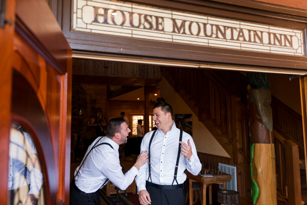 Groom getting ready at Mountain House Inn