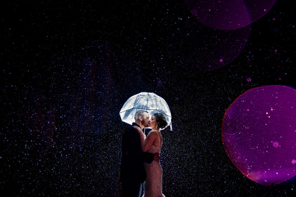 award winning photograph from the rainy parking lot of a laboratory mill wedding