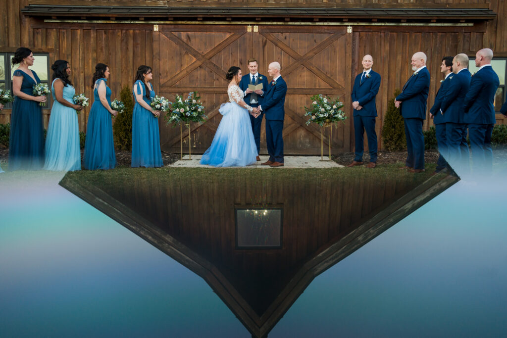 Reflection of wedding barn during wedding ceremony at Pleasant Grove Farm 