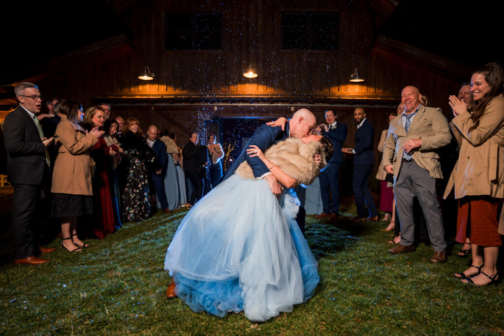 Bride and groom have bubble exit from their wedding reception in winter