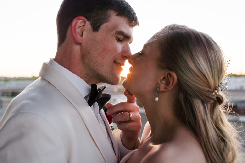 Bride and Groom share romantic sunset portrait after their wedding ceremony during springtime at Terrace at Cedar Hill in Charlotte NC