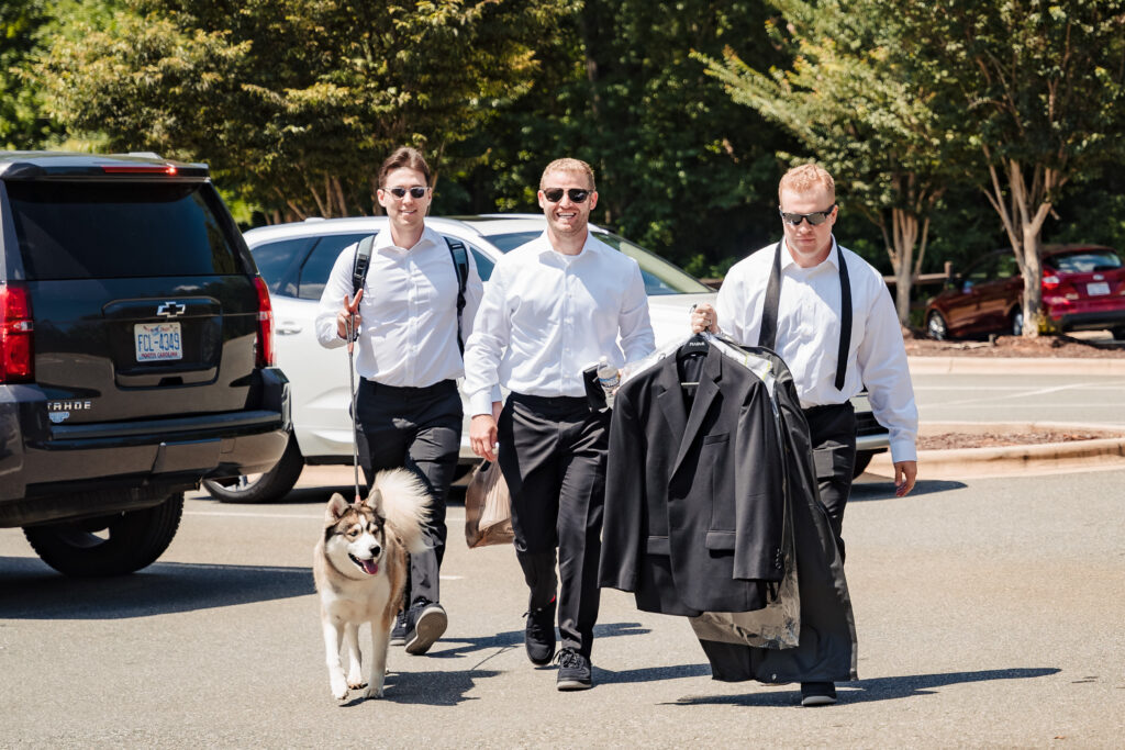 Groom arriving to dog-friendly charlotte wedding venue